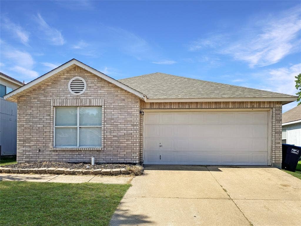 Brick facade, attached garage, shingled roof, front lawn