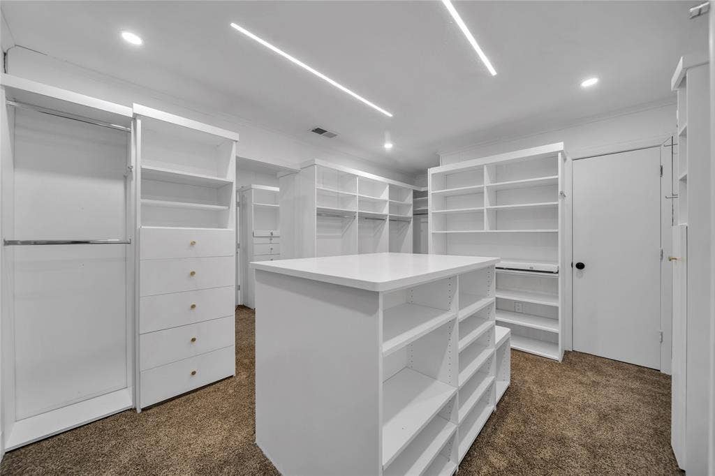 7001 Rocky Top Circle, Dallas, TX 75252 Spacious closet with dark colored carpet