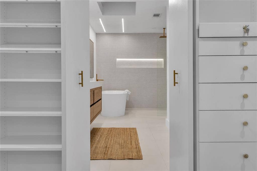 7001 Rocky Top Circle, Dallas, TX 75252 Bathroom featuring tile patterned floors, vanity, separate shower and tub, and tile walls