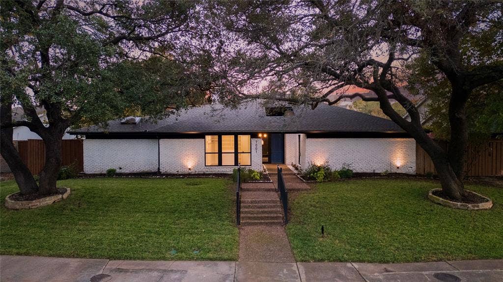 7001 Rocky Top Circle, Dallas, TX 75252 Single story home with a front lawn