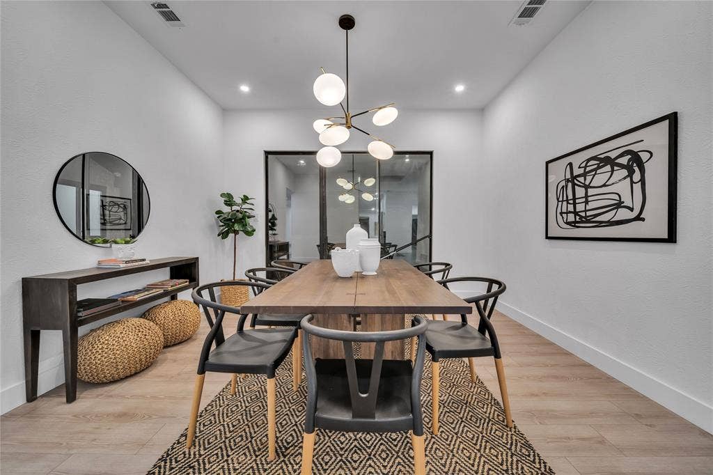 7001 Rocky Top Circle, Dallas, TX 75252 Dining room featuring light hardwood / wood-style flooring and a chandelier