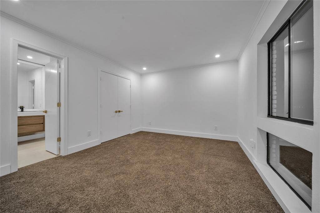 7001 Rocky Top Circle, Dallas, TX 75252 Spare room featuring carpet floors and crown molding