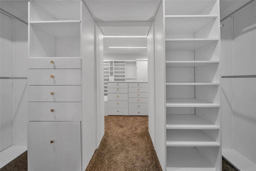 7001 Rocky Top Circle, Dallas, TX 75252 Walk in closet with dark carpet