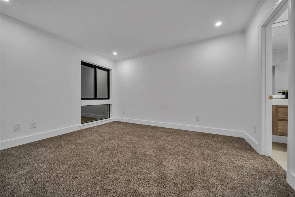 7001 Rocky Top Circle, Dallas, TX 75252 Spare room featuring carpet flooring and ornamental molding