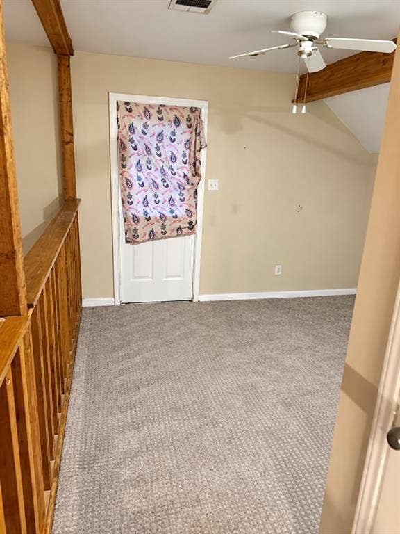1017 W 3rd Street, Taylor, TX 76574 Versatile upstairs nook/flex space with cozy sloped ceilings, perfect for a cozy reading area.