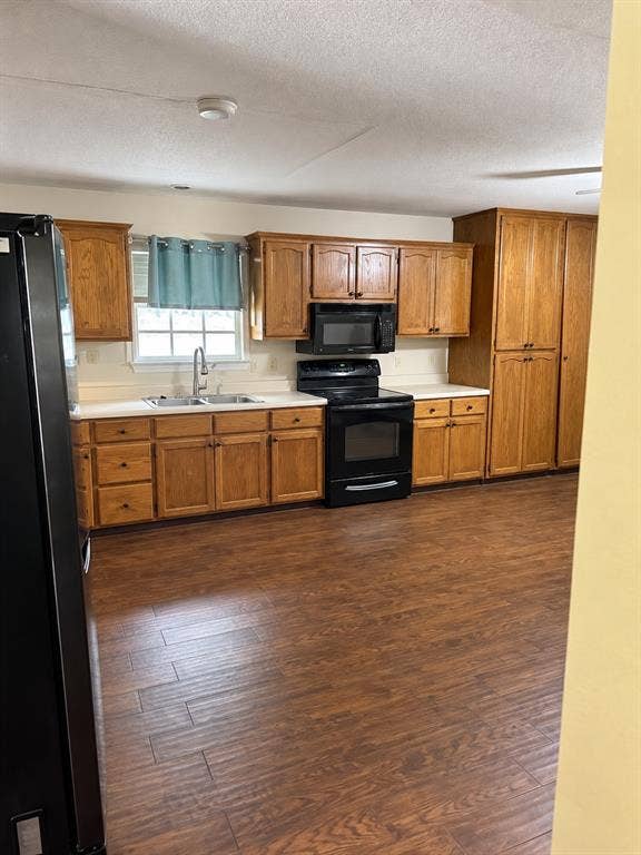 1017 W 3rd Street, Taylor, TX 76574 Kitchen entryway view showcasing the seamless flow into adjacent dining and living areas.