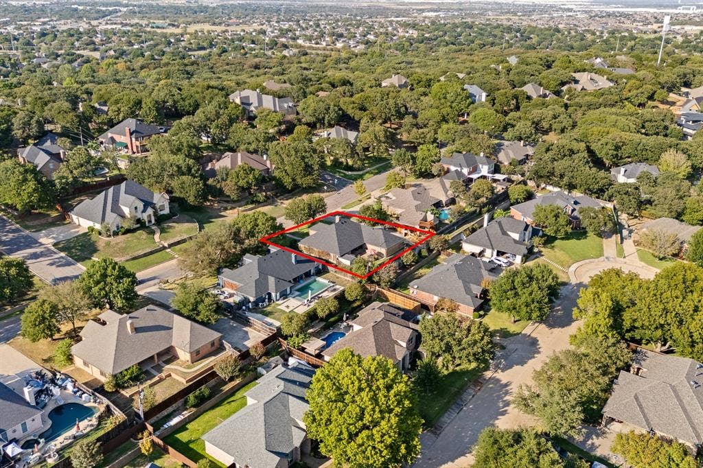 Expansive residential neighborhood featuring numerous mature trees and a manicured streetscape