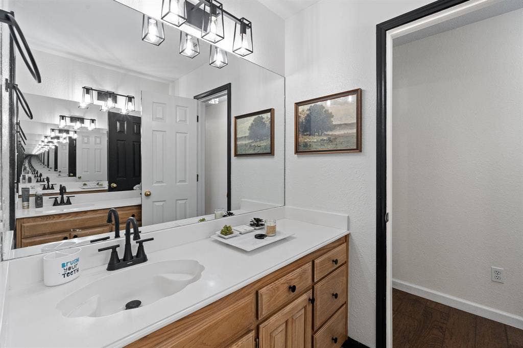White countertop with integrated sink and matte black faucet