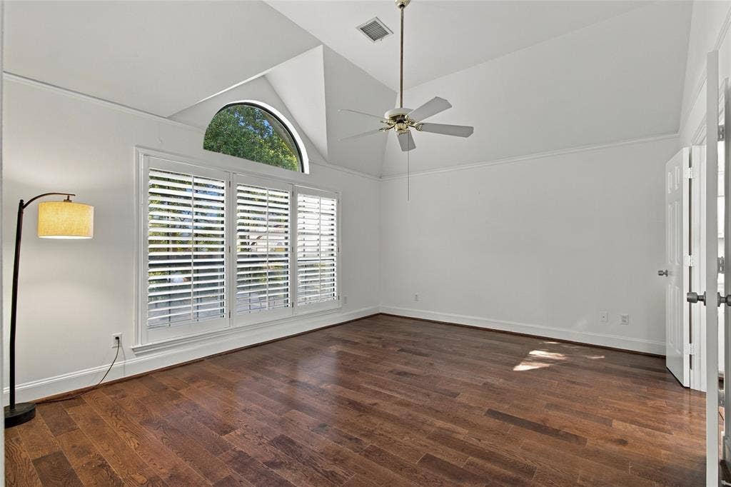 Spacious primary bedroom-split from secondary bedrooms. Wood floors, plantation shutters and vaulted ceiling!