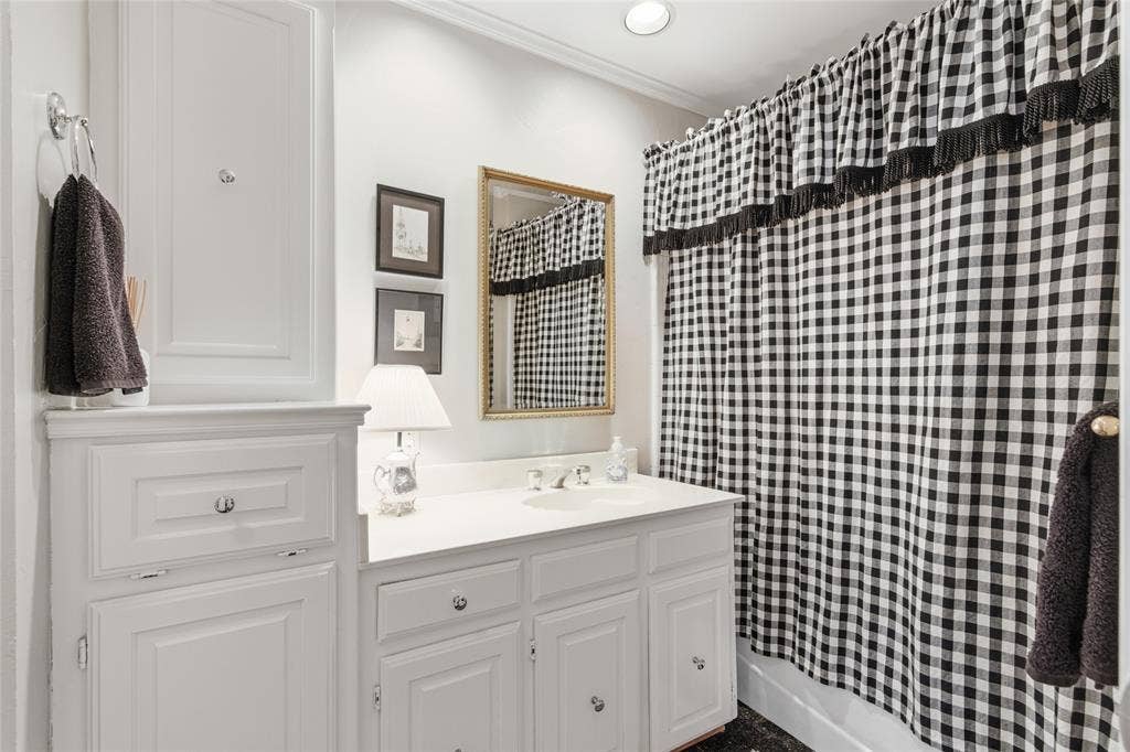 Hall bathroom serving the 2 bedrooms and has plenty of storage!