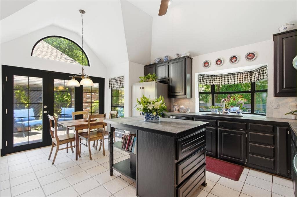 Kitchen with island, window above sink for views of greenspace!