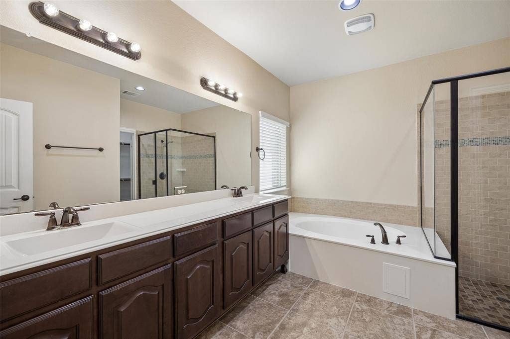 901 Memory Lane, McKinney, TX 75072 Dual vanity with integrated sinks and dark wood-finish cabinetry