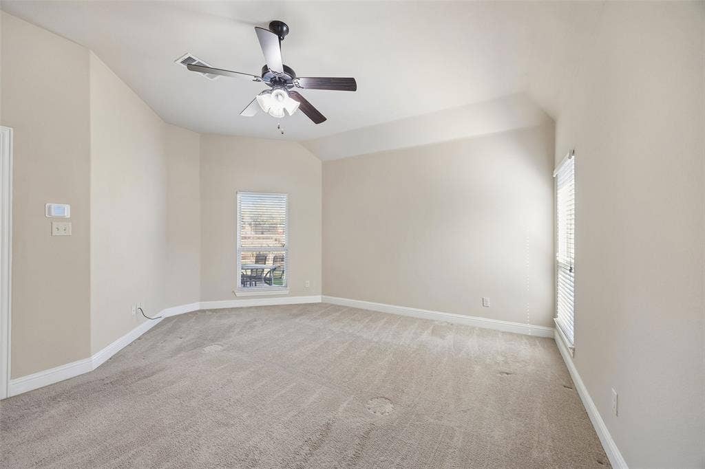 901 Memory Lane, McKinney, TX 75072 Angled walls with neutral paint, light-toned carpet flooring, and a ceiling fan with integrated lighting