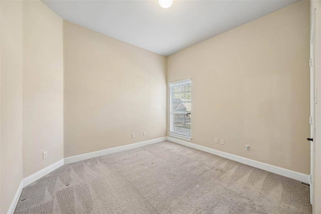 901 Memory Lane, McKinney, TX 75072 Secondary bedroom with carpet and walk in closet