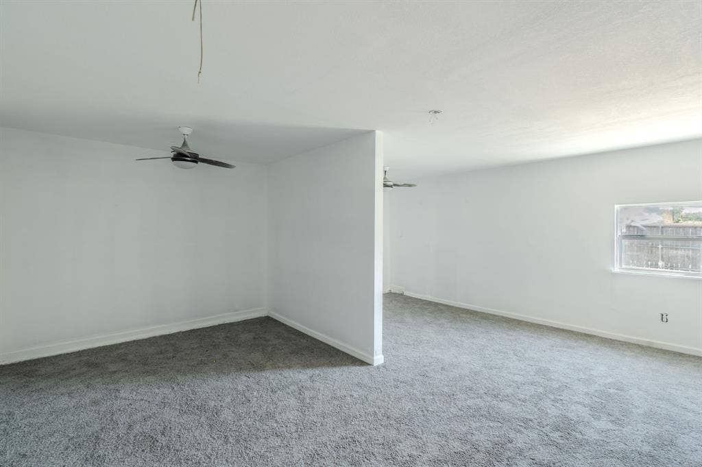 4312 Woodbluff Drive, Mesquite, TX 75150 Grey carpet flooring, white painted walls, and ceiling-mounted fans