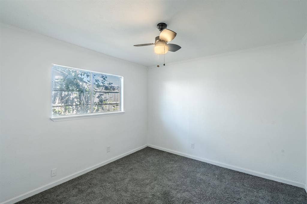4312 Woodbluff Drive, Mesquite, TX 75150 Recessed window, ceiling-mounted fan, and grey carpeting
