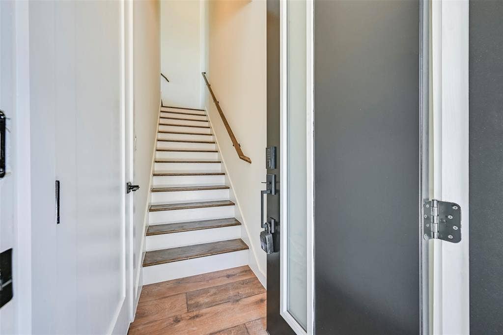 2247 Mail Avenue, #103, Dallas, TX 75235 Staircase with wood-finish treads and white risers