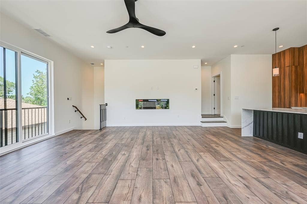 2247 Mail Avenue, #103, Dallas, TX 75235 Wood-finish flooring, recessed lighting, and a modern ceiling fan