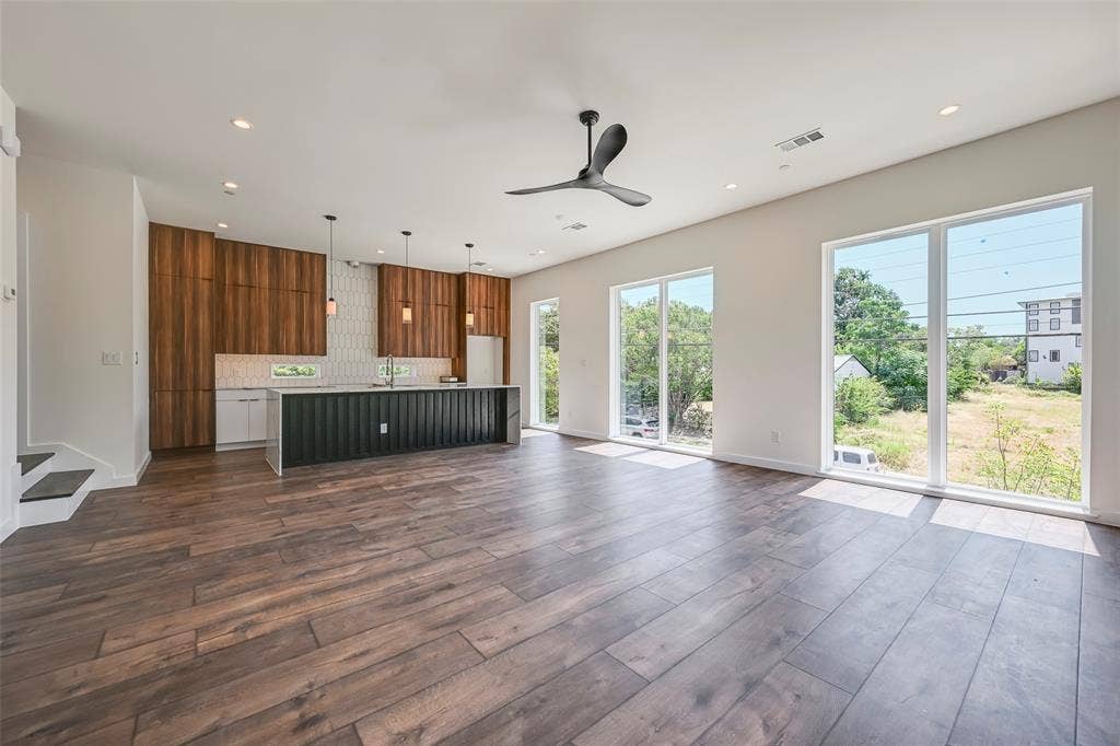 2247 Mail Avenue, #103, Dallas, TX 75235 Open-concept living area featuring wood-finish flooring, recessed lighting, and a modern ceiling fan
