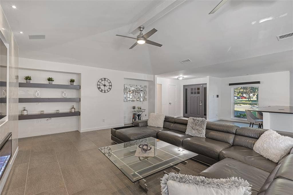 6802 Duffield Drive, Dallas, TX 75248 Vaulted ceilings with recessed lighting, built-in shelving, tile flooring, and a ceiling fan