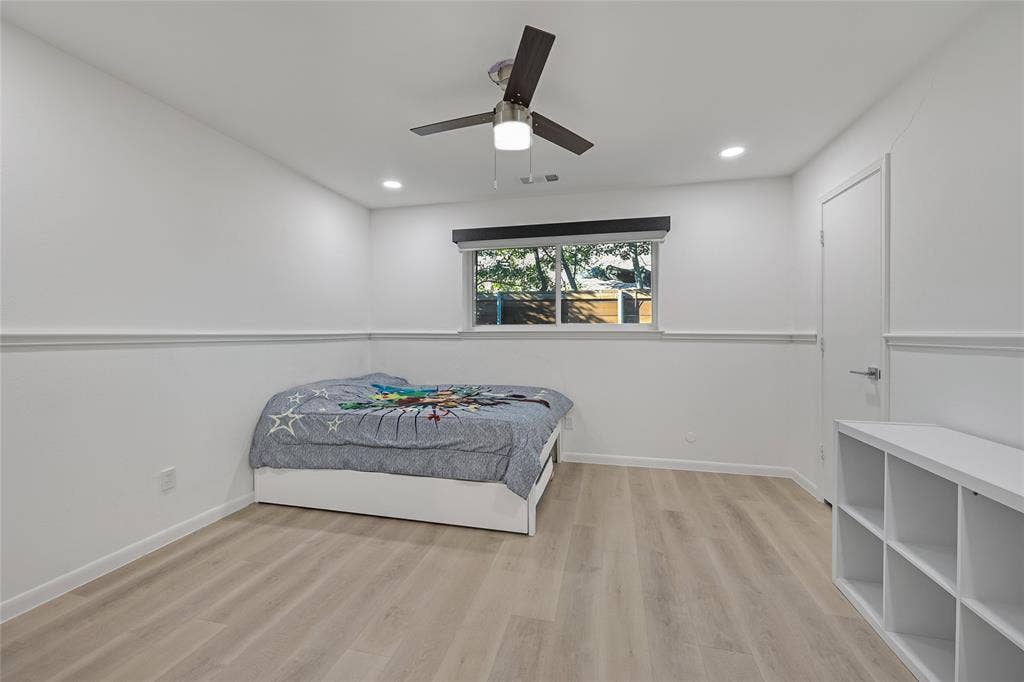 6802 Duffield Drive, Dallas, TX 75248 Recessed lighting, wood-finish flooring, ceiling fan, and white trim