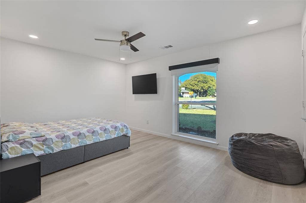 6802 Duffield Drive, Dallas, TX 75248 Recessed lighting, wood-finish flooring, ceiling fan, and a double-hung window