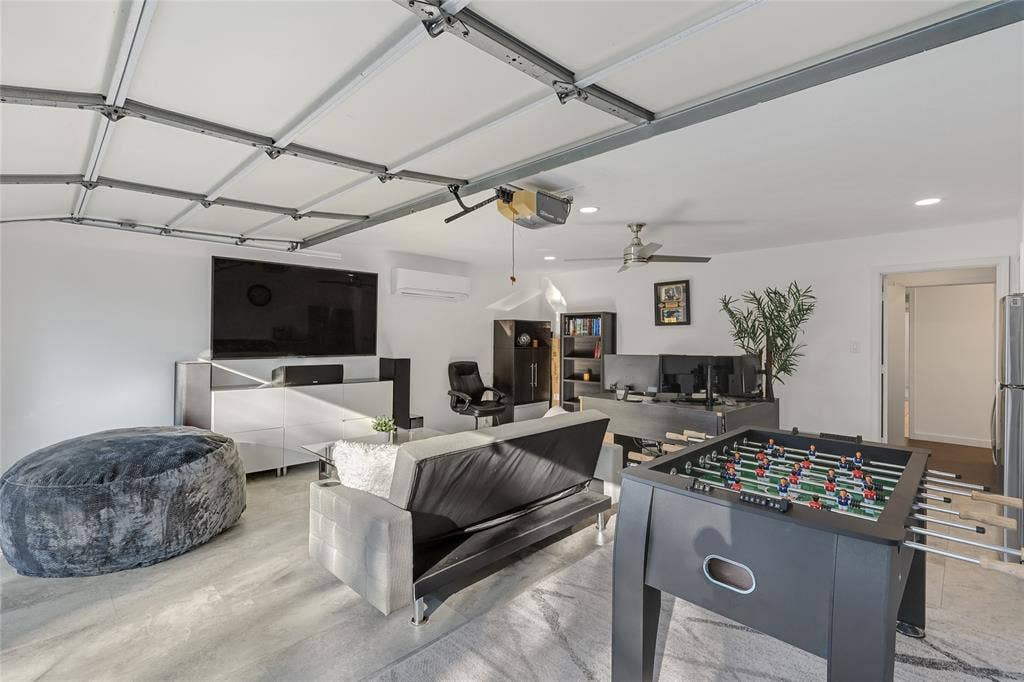 6802 Duffield Drive, Dallas, TX 75248 Recessed lighting, ceiling fan, white walls, and wood-finish flooring create a versatile space