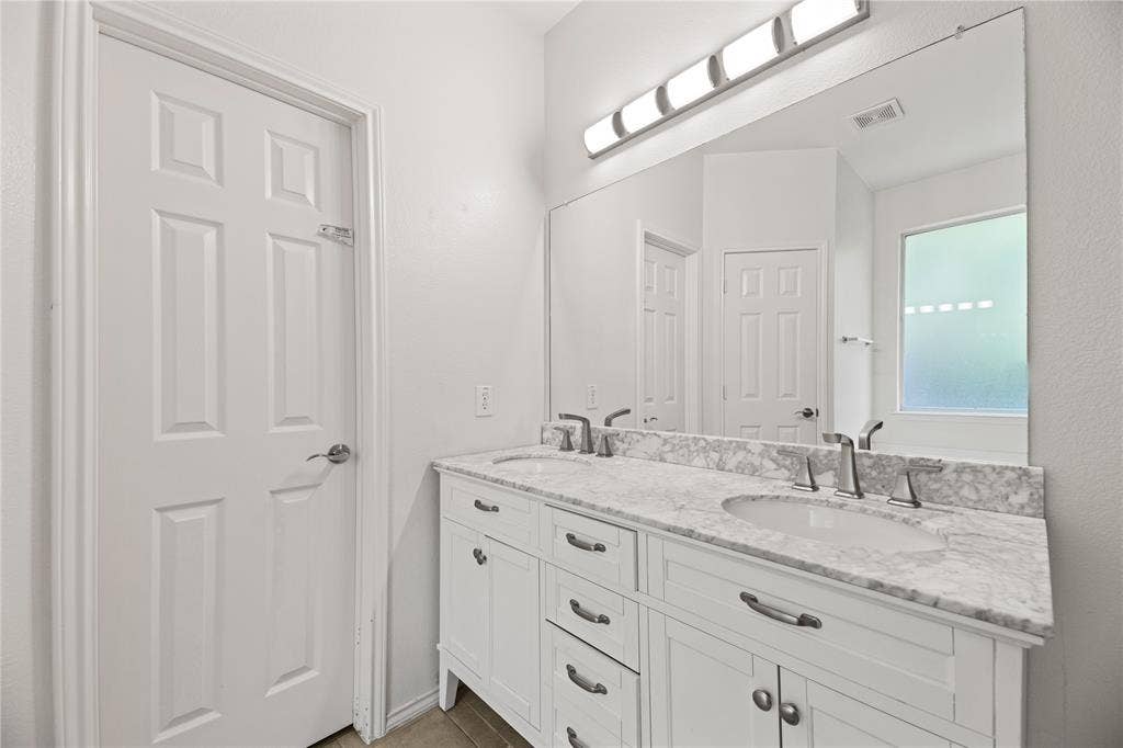 Dual vanity with undermount sinks and chrome fixtures