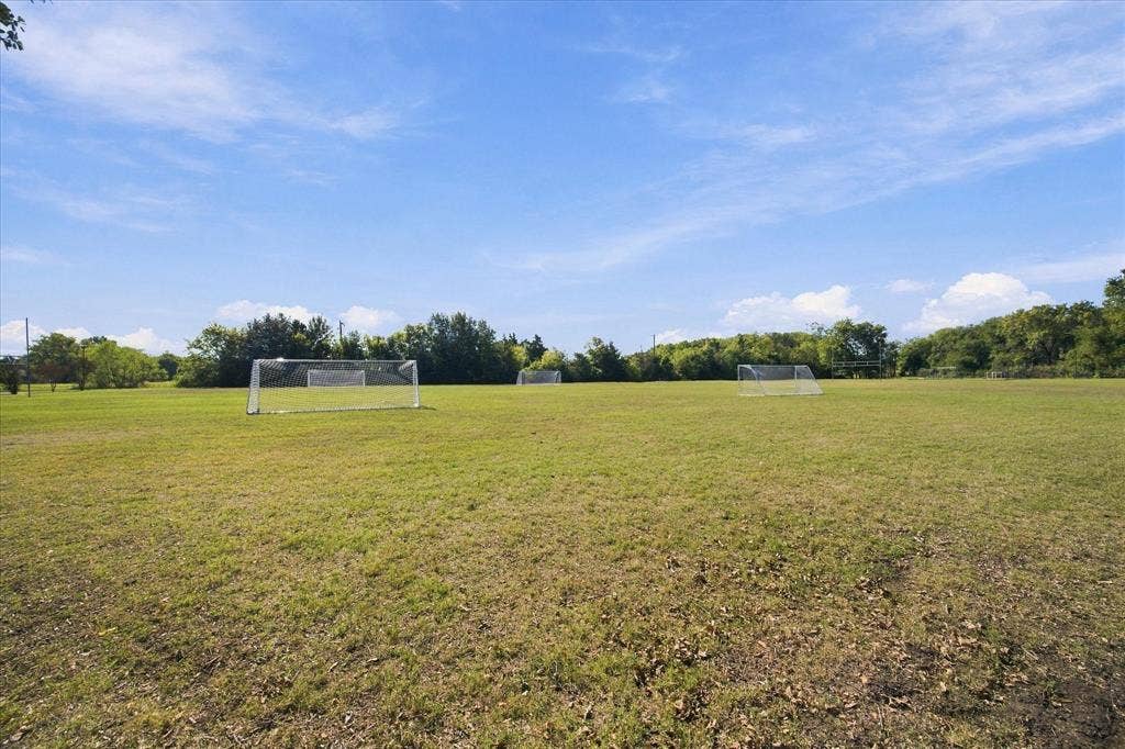 408 Northgate Drive, Terrell, TX 75160 Expansive green space featuring multiple soccer goals and perimeter trees