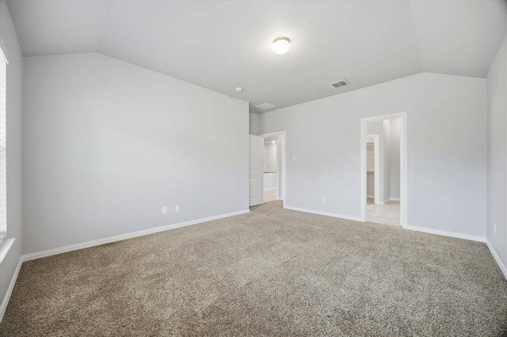 408 Northgate Drive, Terrell, TX 75160 Vaulted ceiling, neutral wall paint, carpeted flooring, window with blinds, and recessed lighting