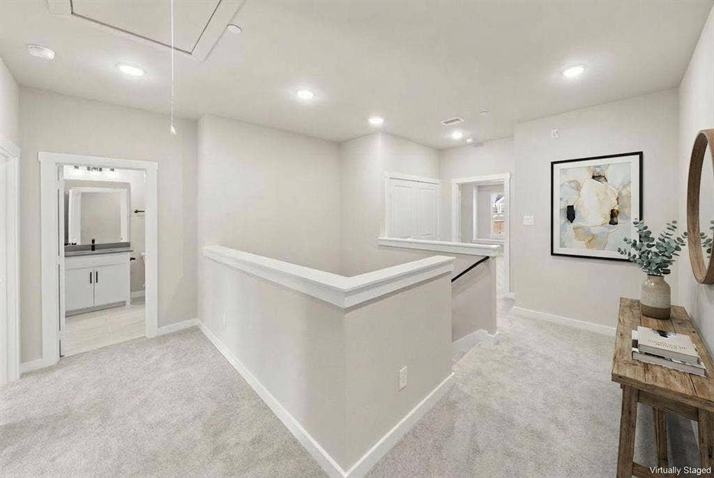 604 Nolan Lane, Wylie, TX 75098 Neutral-toned carpeting, recessed lighting, and a crisp architectural half-wall