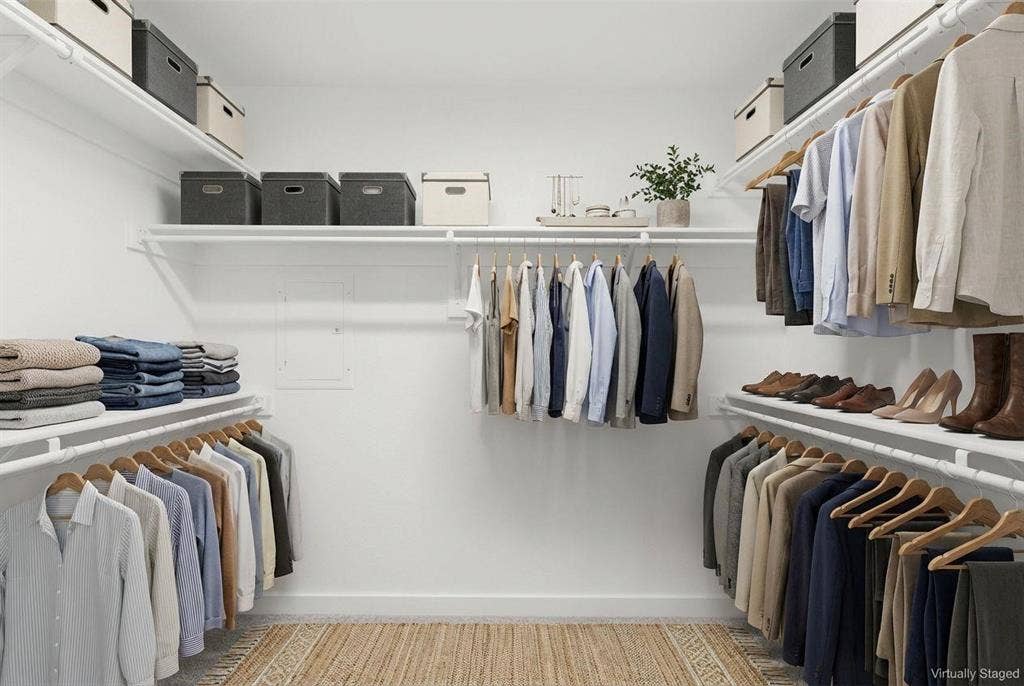 604 Nolan Lane, Wylie, TX 75098 Walk-in closet featuring multi-level white wire shelving, overhead storage racks, and neutral wall finishes