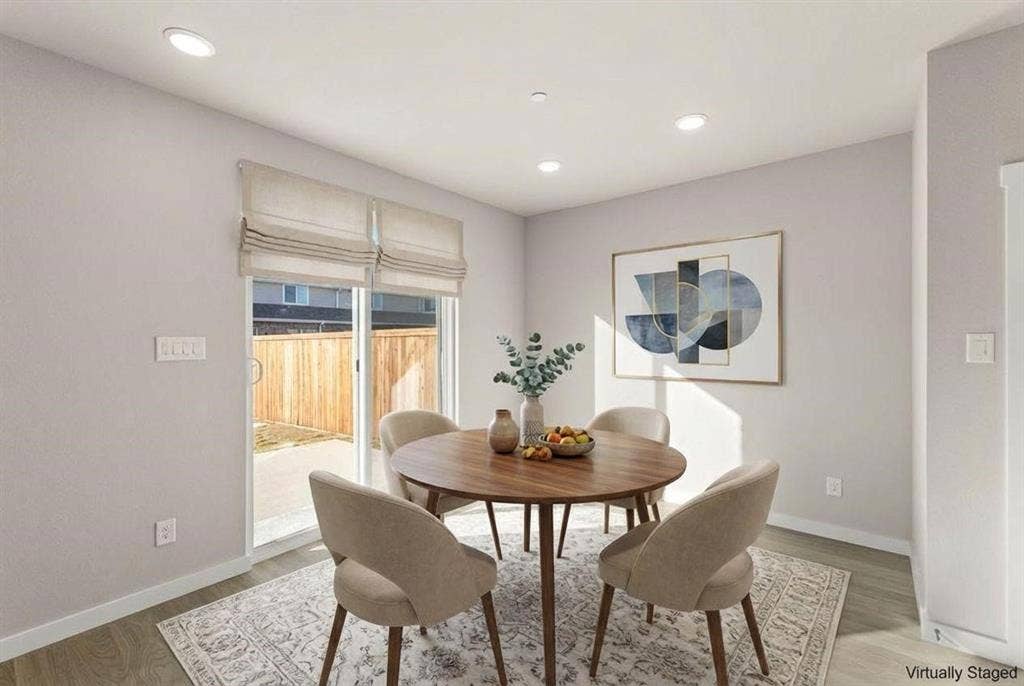 604 Nolan Lane, Wylie, TX 75098 Recessed ceiling lighting, light-tone wood-finish flooring, and a sliding glass door with integrated fabric window shades