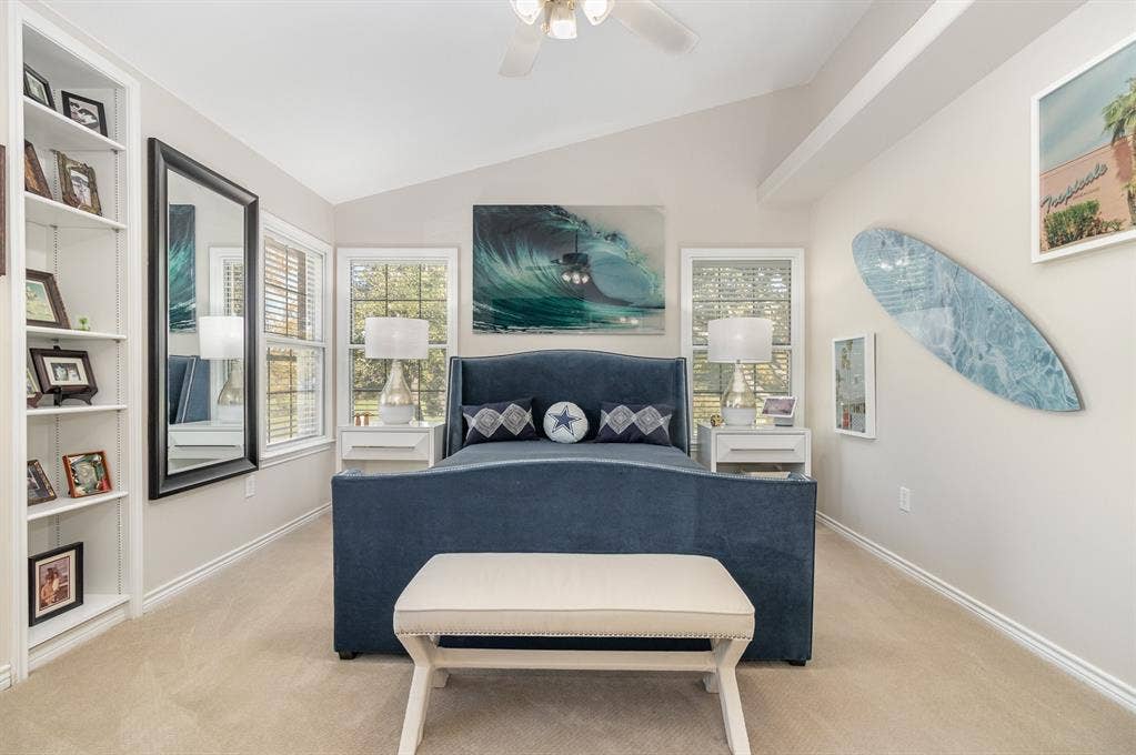 2800 Keller Springs Road, #8C, Carrollton, TX 75006 Primary bedroom with custom built-in shelving, vaulted ceiling, added upper shelf, lighted ceiling fan.