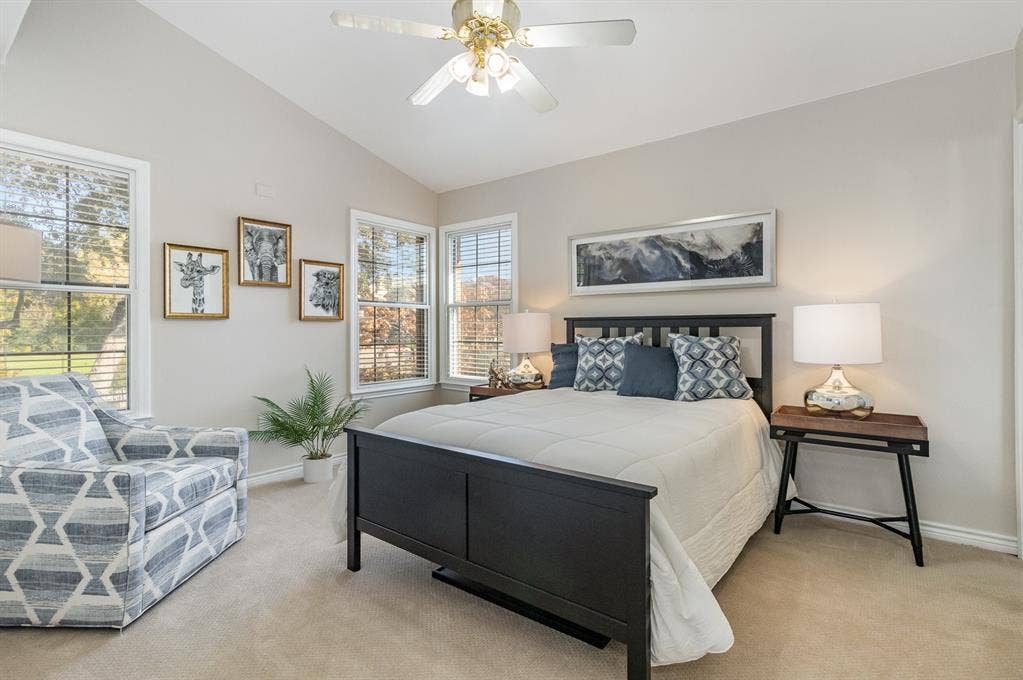 2800 Keller Springs Road, #8C, Carrollton, TX 75006 Secondary bedroom upstairs with elegant double-pane soundproof windows, electric shades, lighted ceiling fan, vaulted ceiling.