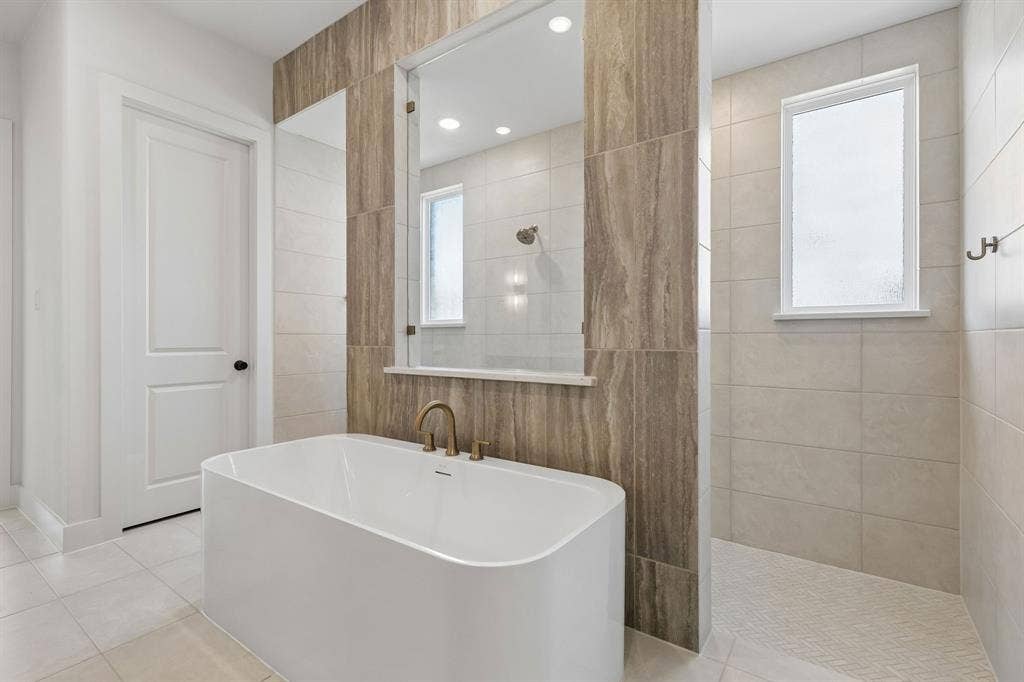 8729 Porch Place, McKinney, TX 75071 The Madison II floor plan features our signature owner's bath with double, walk through shower and drying areas!