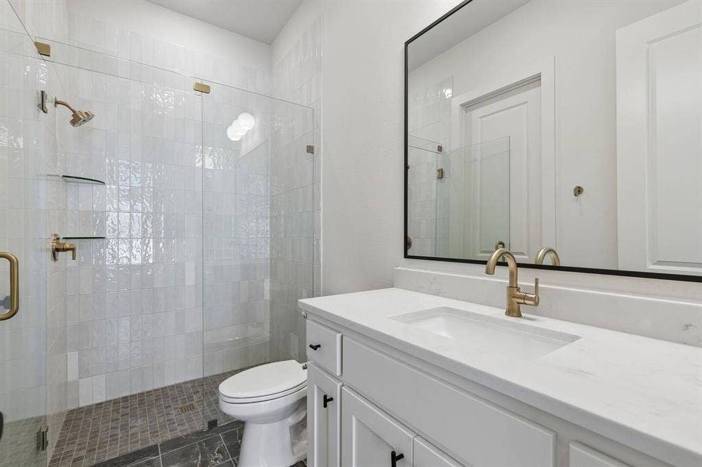 8729 Porch Place, McKinney, TX 75071 Guests will feel right at home in any of the beautiful secondary baths you'll find in our Madison II floor plan.