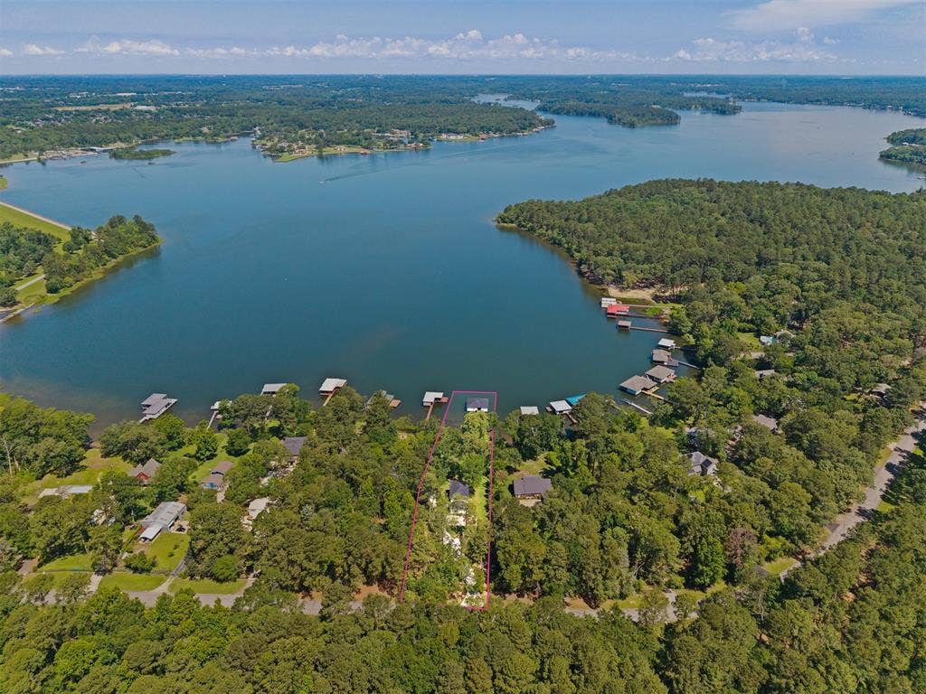 18630 Eastside Road, Troup, TX 75789 Expansive waterfront property featuring mature trees and direct lake access