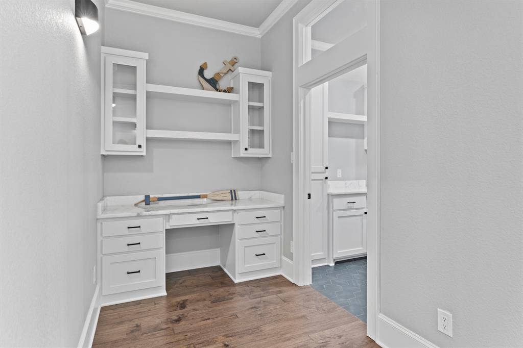18630 Eastside Road, Troup, TX 75789 Built-in desk area featuring white cabinetry, a light-toned countertop, and open shelving