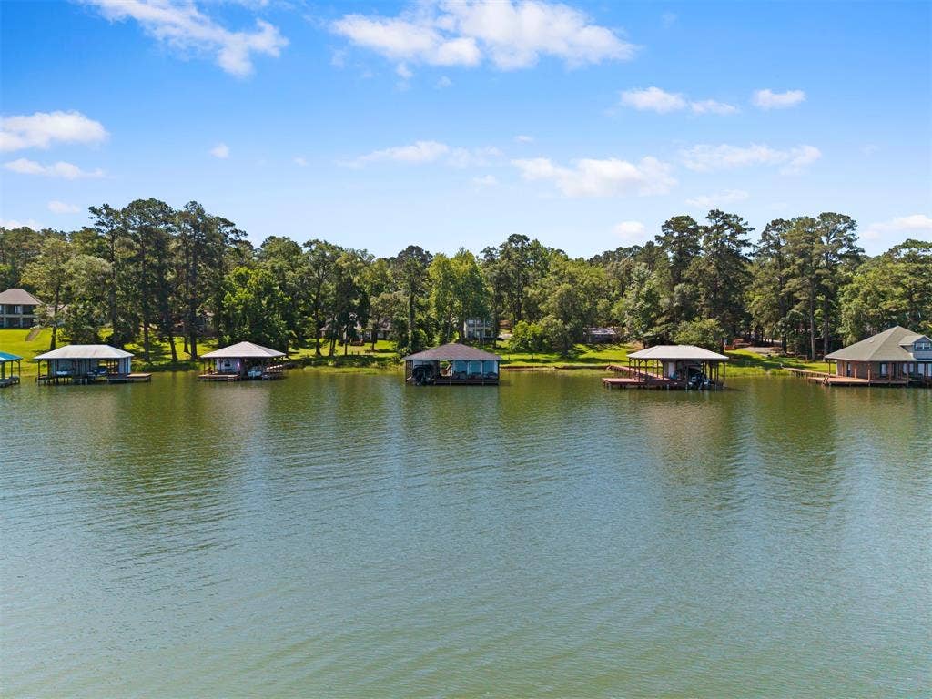 18630 Eastside Road, Troup, TX 75789 Waterfront property featuring boat docks with covered slips and direct lake access