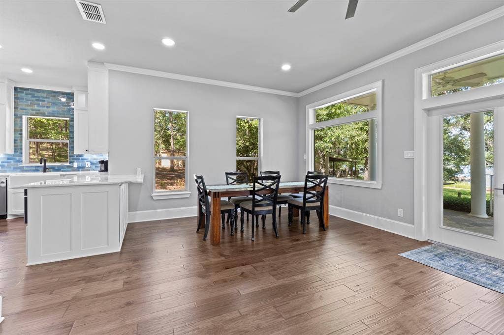 18630 Eastside Road, Troup, TX 75789 Spacious dining area with wood-finish flooring, recessed lighting, and crown molding