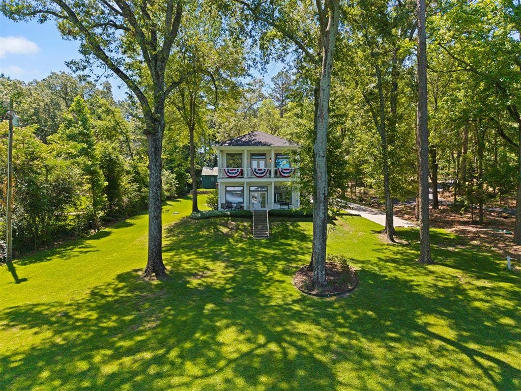 18630 Eastside Road, Troup, TX 75789 Two-story residence with a prominent gabled roof and multiple windows
