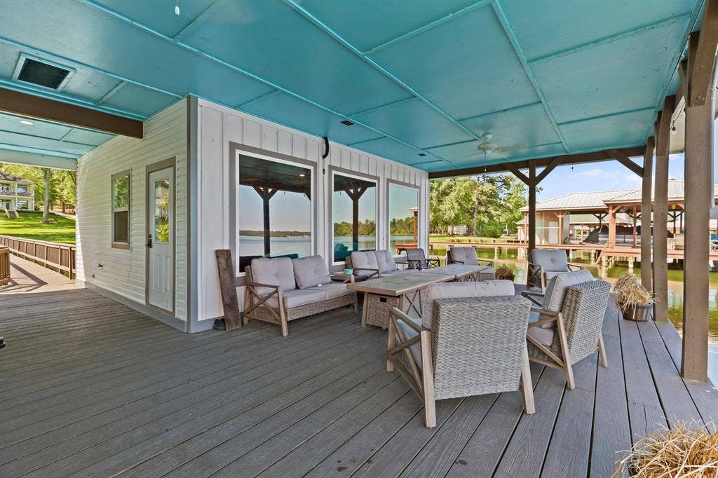 18630 Eastside Road, Troup, TX 75789 Expansive outdoor deck with gray composite decking and a light blue paneled ceiling