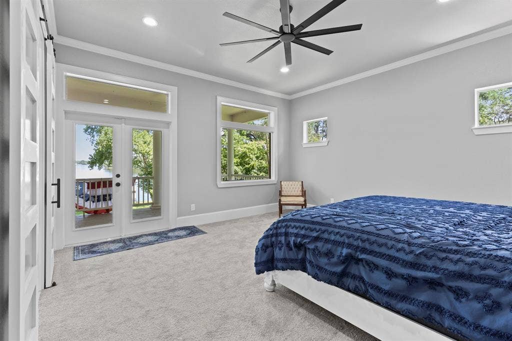 18630 Eastside Road, Troup, TX 75789 French doors with transom window, ceiling fan with integrated lighting, recessed lighting, and crown molding