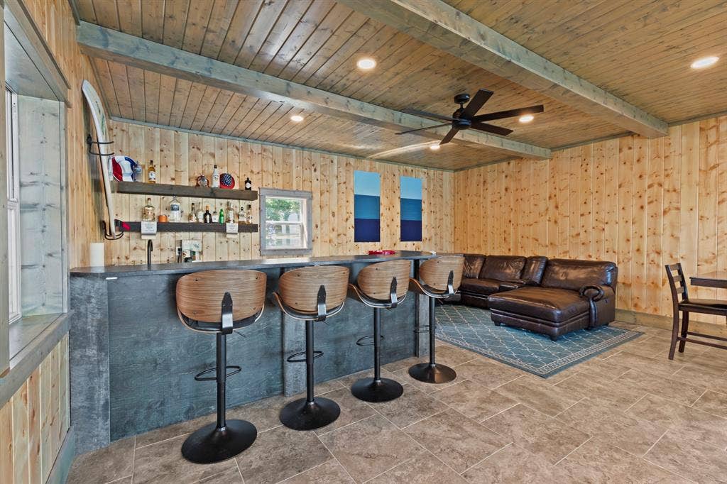 18630 Eastside Road, Troup, TX 75789 Wood-paneled walls and ceiling with exposed beams