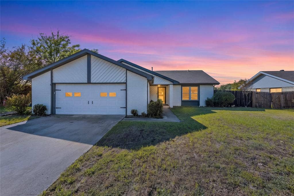 5010 Utah Street, Greenville, TX 75402 White brick exterior with dark trim accents