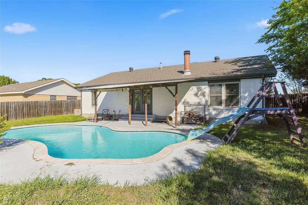 5010 Utah Street, Greenville, TX 75402 In-ground swimming pool with concrete surround
