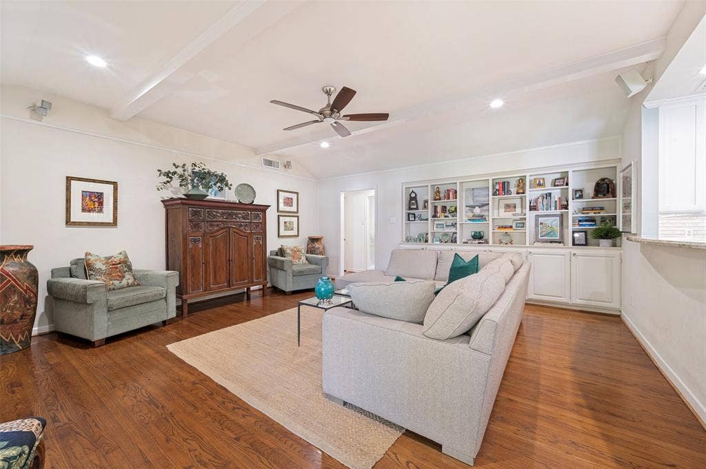 4521 Nashwood Lane, Dallas, TX 75244 Hardwood flooring, vaulted ceiling, recessed lighting, ceiling fan, and built-in shelving with cabinetry