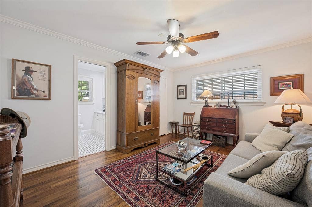 4521 Nashwood Lane, Dallas, TX 75244 Hardwood flooring throughout, crown molding, ceiling fan, and recessed window with blinds