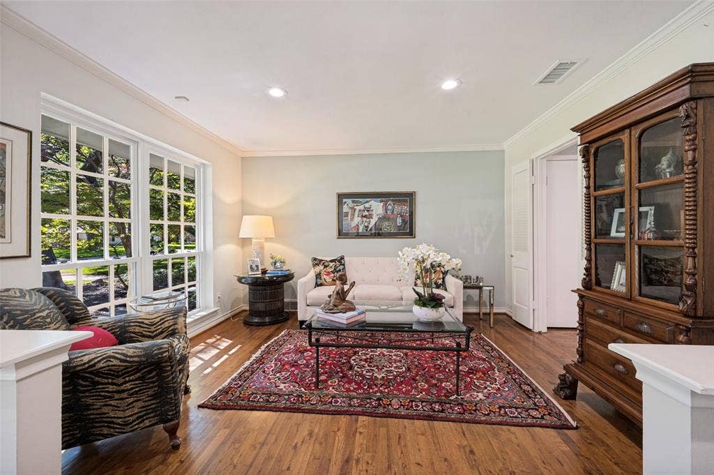 4521 Nashwood Lane, Dallas, TX 75244 Hardwood flooring, crown molding, recessed lighting, and a large multi-pane window